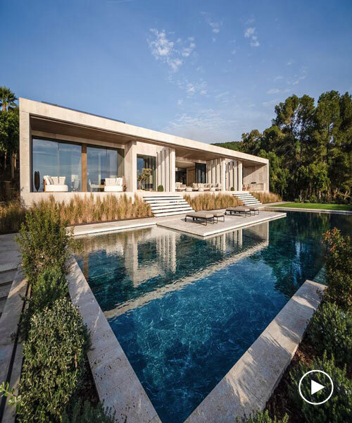 ARK architects elevates villa tai on stone podium framing views of mediterranean sea