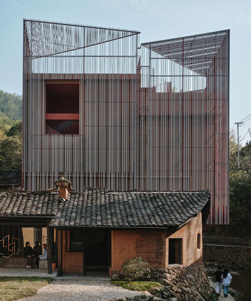 rural art museum's aluminum lattice facade by team_bldg shimmers above chinese village