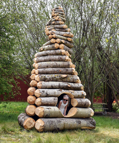timber twist by ulf mejergren and travis child reimagines larvae shelter as spiraling log cabin