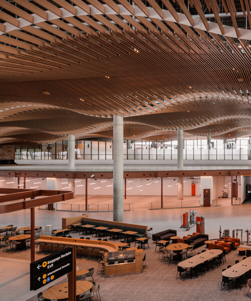 zaha hadid and woods bagot shape sydney airport terminal with undulating timber modules